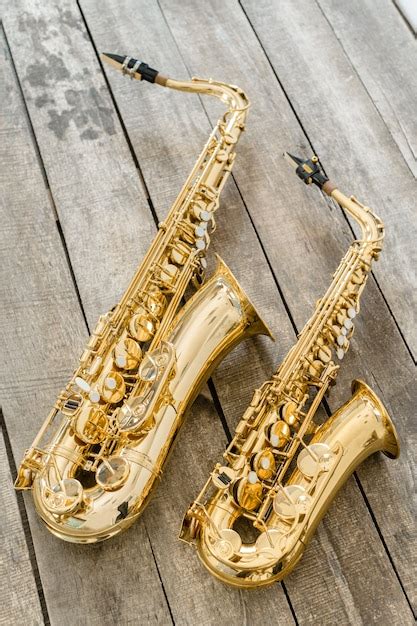 Premium Photo Beautiful Golden Saxophone On Wooden Floor