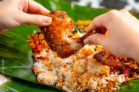 Indonesian Padang Food Or Nasi Bungkus With Padang Fried Chicken