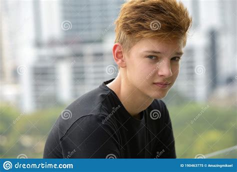 Young Handsome Teenage Boy Against View Of The City Outdoors Stock