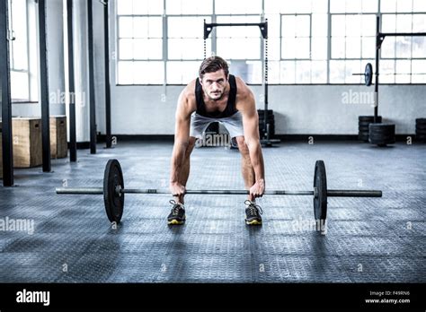 Fit Man Lifting Heavy Barbell Stock Photo Alamy