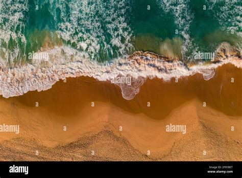 Aerial View Of Ocean Waves And Sandy Beach Top View Of Sea Coast With