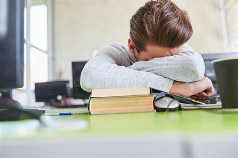 Fatigue Student Sleeps On His Desk Stock Photo Image Of Exhausted