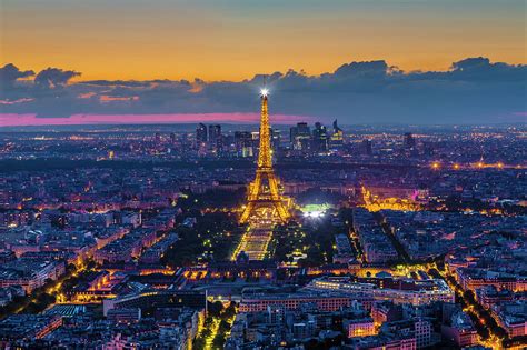 Eiffel Tower And Paris Skyline At Night By Pawel Libera