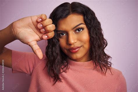 Young Beautiful Transsexual Transgender Woman Standing Over Isolated Pink Background With Angry