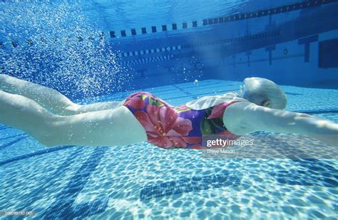 Woman Swimming Underwater In Pool Photo Getty Images