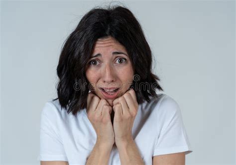 Portrait Of A Young Attractive Woman Looking Scared And Shockedhuman