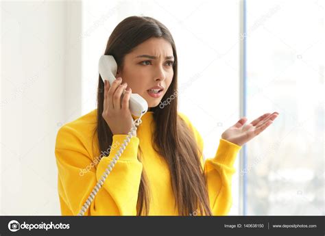 Woman talking by telephone — Stock Photo © belchonock #140638150