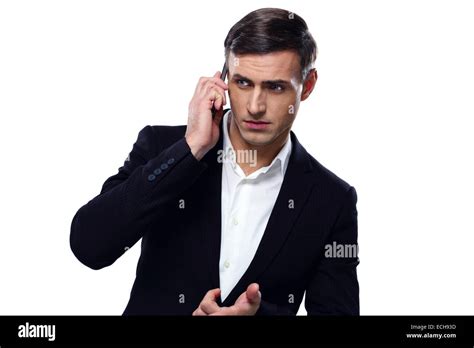 Pensive Businessman Talking On The Phone Over White Background Stock