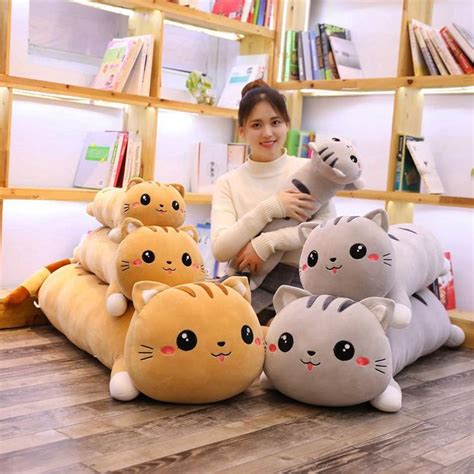 A Woman Sitting On The Floor Surrounded By Stuffed Animals