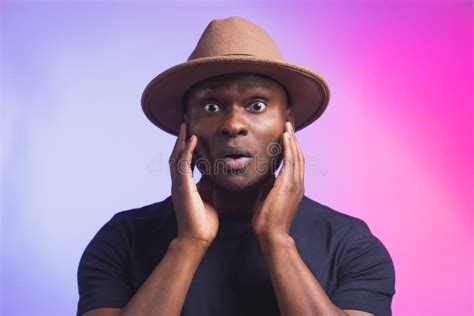 Portrait Of Excited Young African American Male Screaming In Shock And