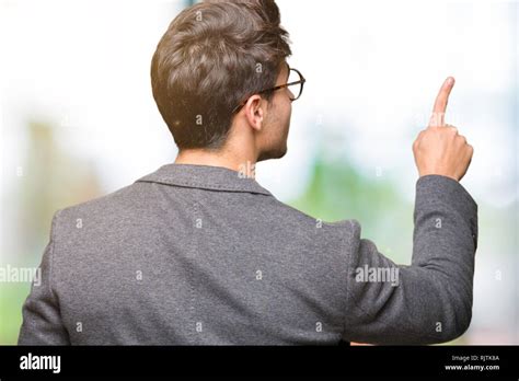 Young Business Man Wearing Glasses Over Isolated Background Posing