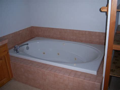 Whirlpool vs air baths vs soaking tubs. Can whirlpool tub be converted to regular tub?
