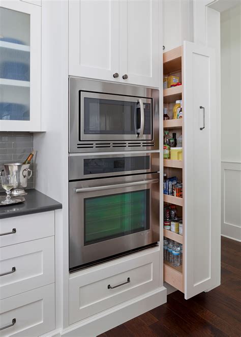 Hidden Pull Out Pantry Design With Built In Oven And Microwave