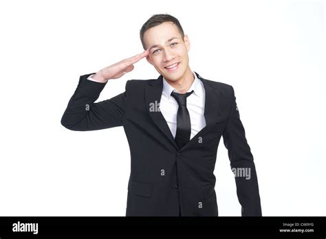 Young Businessman Saluting Stock Photo Alamy