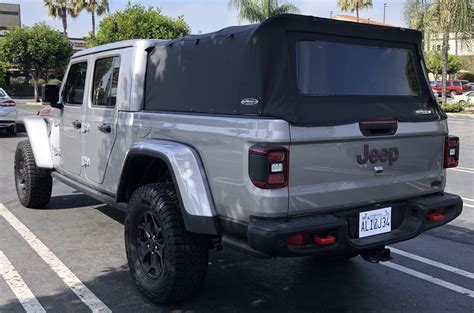 Added the front drop/slider window, dual rope lights, pet screens, yakima racks, and ordered it in matte black. Thoughts on a soft topper? | Jeep Gladiator Forum ...