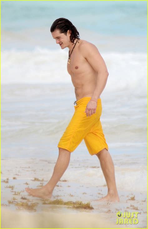 Orlando Bloom Shows Off His Soaking Wet Shirtless Body On The Beach With A Mystery Blonde