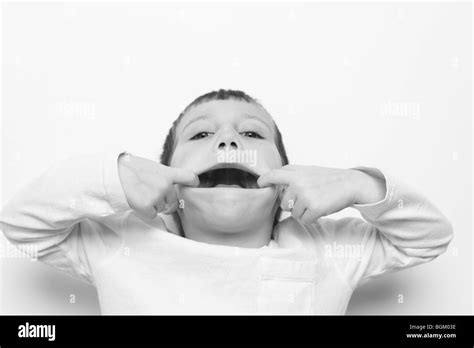 Young Boy Makes A Funny Face Stock Photo Alamy