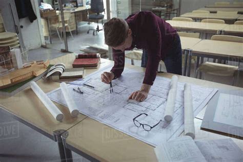 Architect Working At Desk In Studio Stock Photo Dissolve