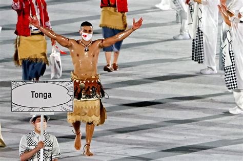 two shirtless flag bearers for olympic opening ceremony oiled up tongan joined by vanuatu rower