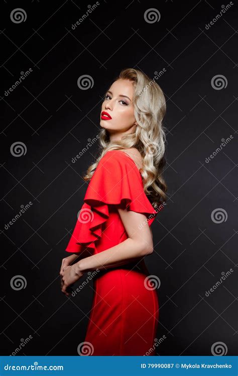beautiful blonde girl in red evening dress over grey background stock image image of