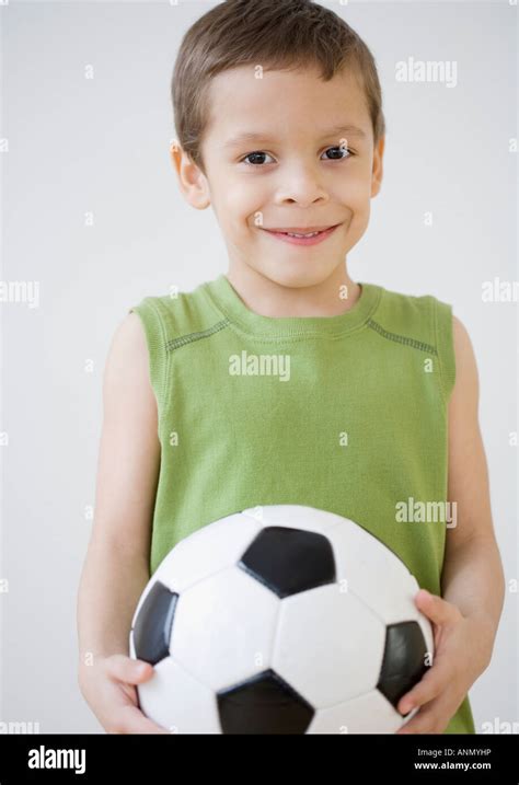 Boy Holding Soccer Ball Stock Photo Alamy