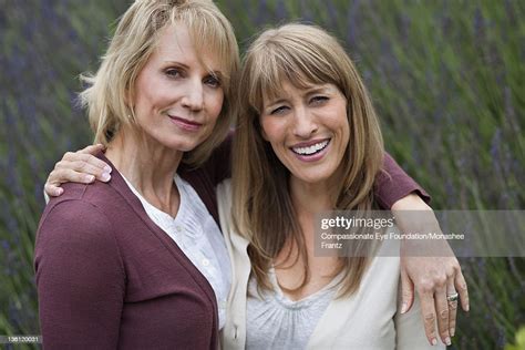 Mature Women In Garden Smiling Photo Getty Images
