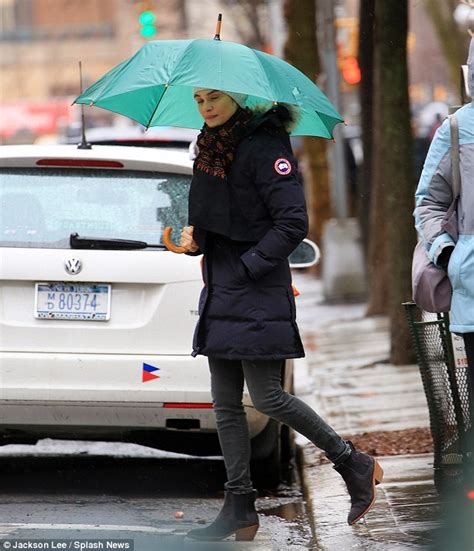 Rachel Weisz Looks Fresh Faced As She Runs Errands In Rainy New York