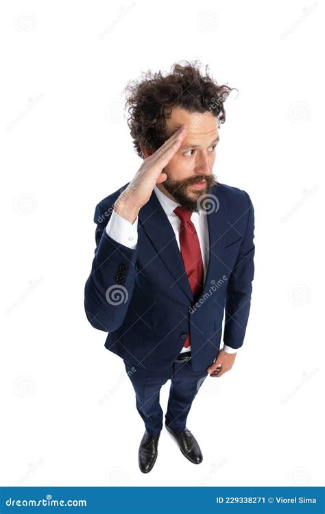 Young Businessman Saluting And Looking To The Side Stock Image Image