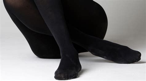 women`s legs and feet in tights legs and feet in black and tan tights 2