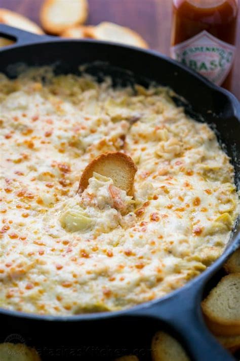 Swiss and salami have had their day. Holiday Shrimp Artichoke Dip (VIDEO Recipe) - NatashasKitchen.com