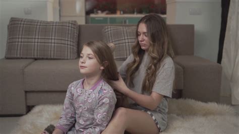Older Sister Combing Hair Of Younger Girl Stock Footage Sbv 330982245
