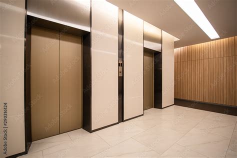Modern Steel Elevator Cabins In A Business Lobby Or Hotel Store