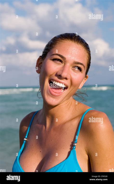 Female Wet Blonde Hair Off Face Wearing Turquoise Blue Bikini Top Stock