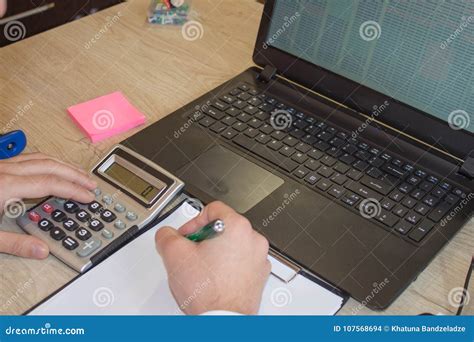 Hands Of Accountant With Calculator And Pen Businessman Using A