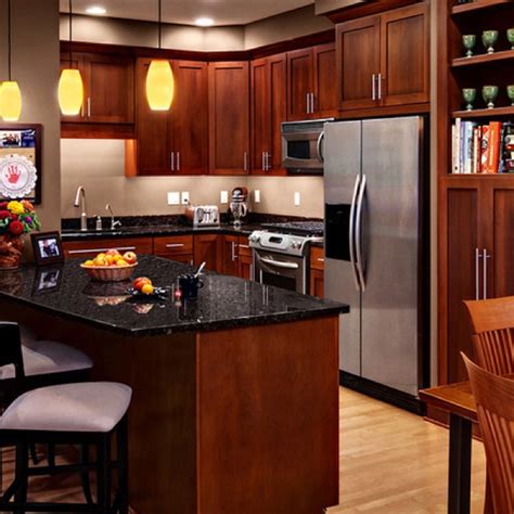 Gray countertops match the color of the metal making the room a good color scheme. 20 best Countertops for Cherry Cabinets images on ...
