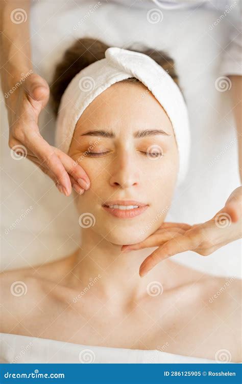 Woman Receiving Relaxing Facial Massage Stock Image Image Of Hand