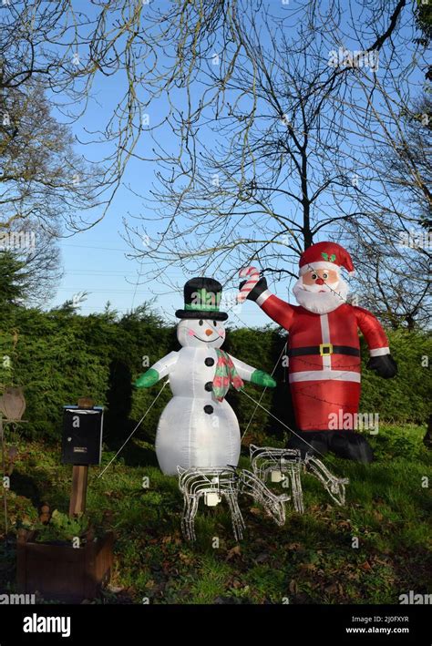 Inflatable Snowman And Father Christmas England Stock Photo Alamy