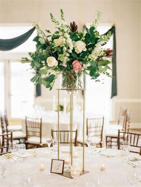 Picture Of A Tall And Chic Wedding Centerpiece Of White