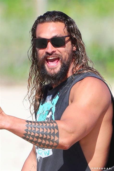 the only thing wrong with jason momoa s beach outing is that he s wearing a shirt scruffy beard