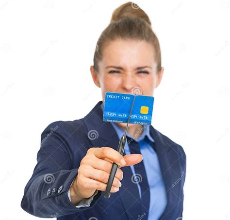 Angry Business Woman Cutting Credit Card With Scissors Stock Image