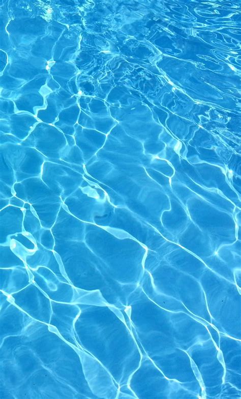 Download Sparkling Blue Pool Water On A Sunny Day