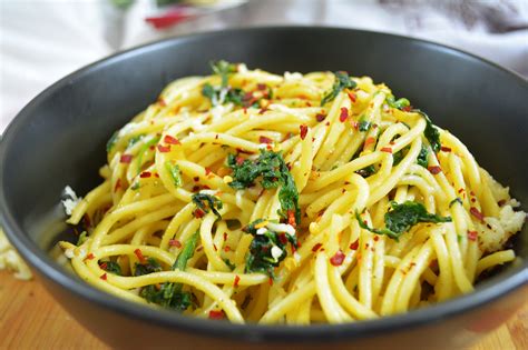 Drain the pasta, reserving a cup or so of the liquid and place back in the pot. Spaghetti Aglio Olio With Parmesan & Greens Recipe by ...