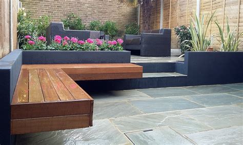 Such a garden contained the natural naturalness of the english landscape park, the practicality the next is nostalgic motives. Modern garden design London natural sandstone paving patio design hardwood floating bench grey ...