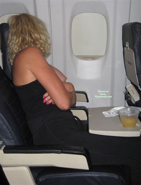 Naughty Blond With Curls Exposing Tits On An Airplane