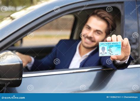 Young Man Holding Driving License In Car Stock Image Image Of