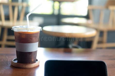 A Plastic Glass Of Iced Americano Coffee Mix With Fresh Orange Juice