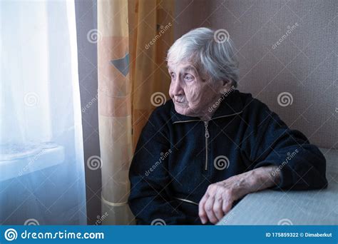 An Old Depressed Loneliness Woman In His House Looking At Nothing Help