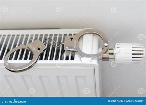 Handcuffs On The Radiator Police Handcuffs And Collar Stock Image