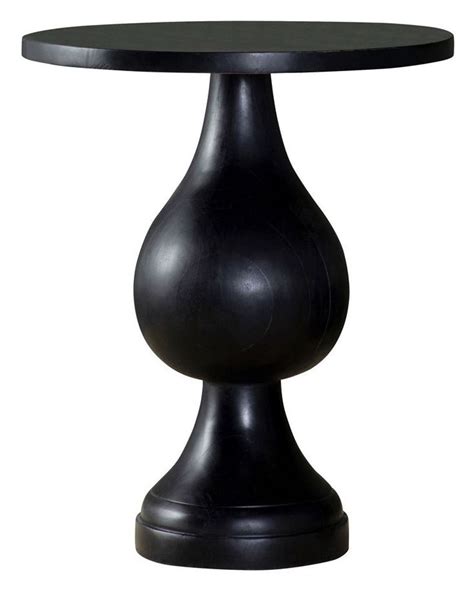 Showcasing An Alluring Silhouette This Modern Accent Table Offers A
