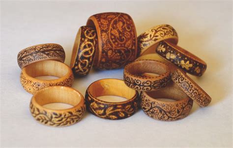 A Group Of Wooden Rings Sitting On Top Of A White Table